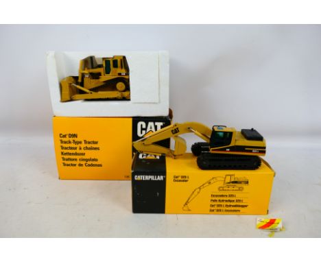 NZG - Two boxed 1:50 scale diecast Caterpillar construction model vehicles from NZG. Lot consists of NZG #298 Caterpillar D9N