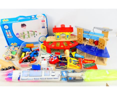 Toys R Us - Big Jigs Rail - A quantity of loose wooden children's train toys to include Trains, building and other accessorie