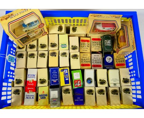 Lledo - A boxed collection of 50 diecast model vehicles from Lledo. Lot includes Lledo DG11002 Horse Drawn Removal Van 'Big T