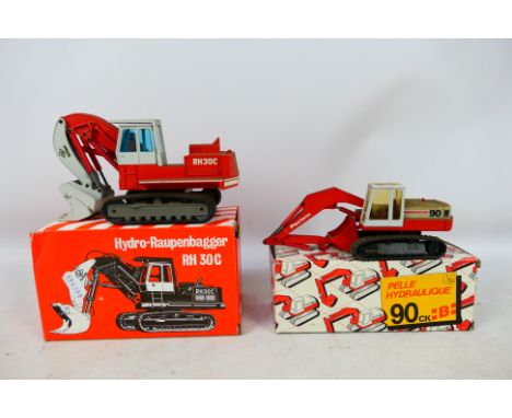 Conrad - NZG - 2 x boxed models in 1:50 scale, O&K RH30C Hydraulic Excavator # 246 and a Poclain 90B Hydraulic Excavator # 28