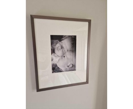 A Framed Photoprint Of A Newborn Baby Signed Esther Ling Mounted In A Grey Profile Frame 38 x  47cm Born In South Korea And A
