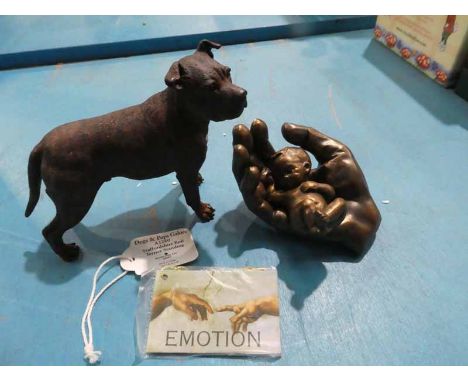 A Border of Fine Arts A1260 Staffordshire Bull Terrier standing and a cold cast model baby in hand