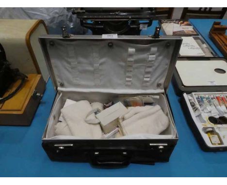 A Vintage alloy cased First Aid Kit and contents in Vinyl cover