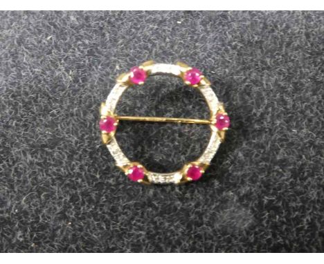 A 9ct Gold Ruby and Diamond Chip Hoop Brooch, 5.1g,25mm diameter 