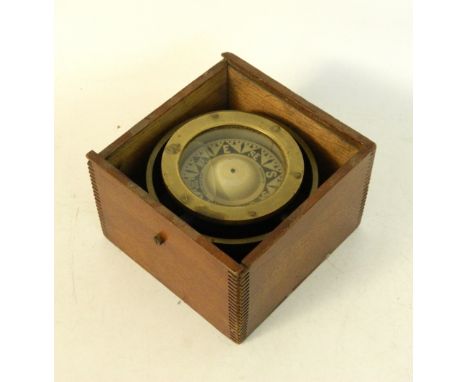 SHIPS GIMBAL COMPASS 
contained in an oak case, the dial marked 'M.H.Lang & Co. Glasgow', 19.5cm wide 