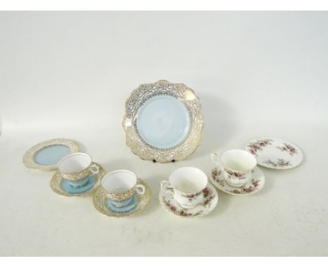ROYAL STAFFORD PART TEA SERVICE
with light blue and gilt decoration, comprising eight cups, ten saucers, eight side plates an