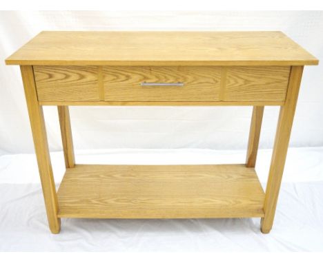 LIGHT OAK SIDE CABINET
with a panelled frieze drawer and an undertier, standing on square supports with spade feet, 110cm wid