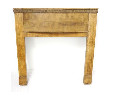 OAK BOW FRONT FIRE SURROUND
with a moulded top above a carved frieze, 124cm wide x 124.5cm high  