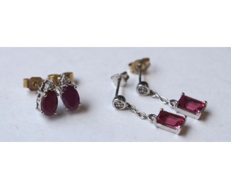 PAIR OF RUBY AND DIAMOND DROP EARRINGS
and a pair of ruby and diamond stud earrings, both in nine carat white gold