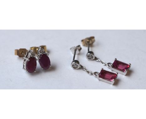 PAIR OF RUBY AND DIAMOND DROP EARRINGS
and a pair of ruby and diamond stud earrings, both in nine carat white gold