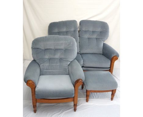 MODERN OAK FRAMED THREE PIECE SUITE 
comprising two armchairs and a two seat sofa, all with button back cushions standing on 