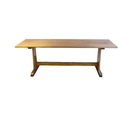 LIGHT OAK REFECTORY TABLE
with a plank top, standing on shaped end supports united by a stretcher, 228.5cm long 
Note: origin