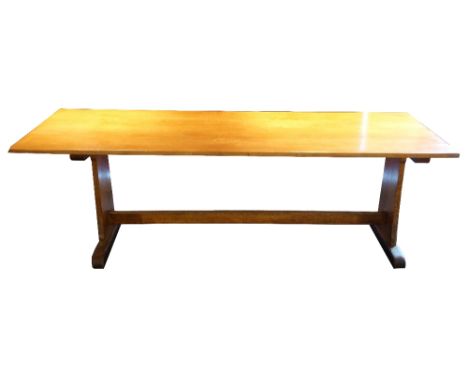 LIGHT OAK REFECTORY TABLE
with a plank top standing on shaped end supports united by a stretcher, 229cm long 
Note: originall