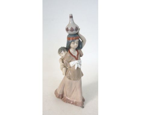 LLADRO FIGURINE 'PRECIOUS PAPOOSE'
number 6423, modelled as a native American with child in papoose and carrying a pot on her