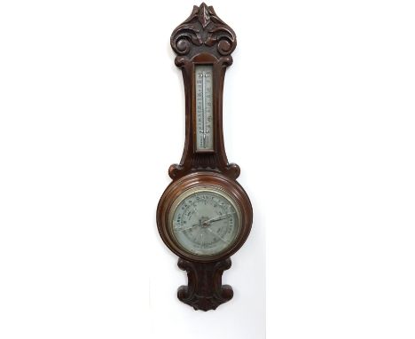 MAHOGANY ANEROID BAROMETER
of shaped outline with a thermometer, 64cm  