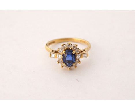 FINE SAPPHIRE AND DIAMOND CLUSTER RING
the central oval cut sapphire approximately 1.25cts in twelve diamond surround with fu