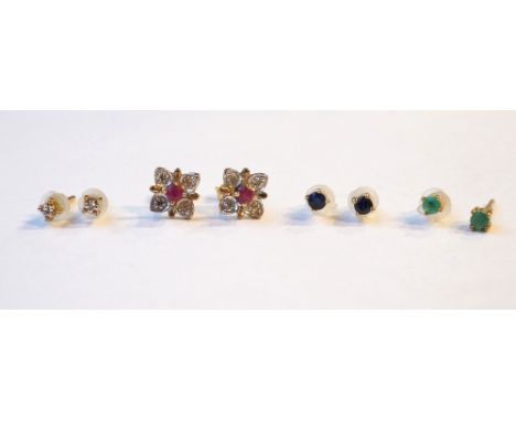 CASED SELECTION OF FOUR PAIRS OF GEM SET NINE CARAT GOLD STUD EARRINGS
comprising diamond, ruby and diamond, sapphire and eme