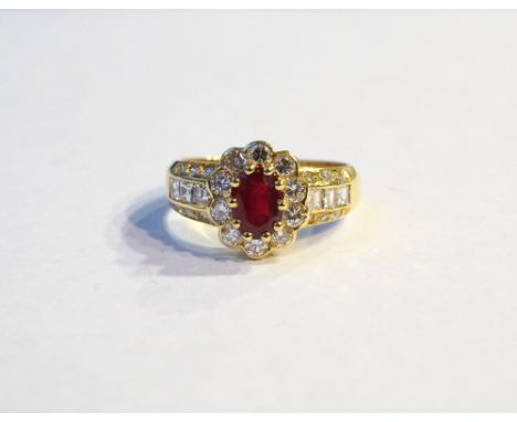 RUBY AND DIAMOND CLUSTER DRESS RING
on eighteen carat gold shank, the central oval cut ruby approximately 0.82cts in diamond 