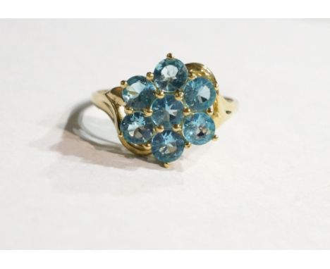 BLUE TOPAZ CLUSTER DRESS RING
on nine carat gold shank, ring size R-S