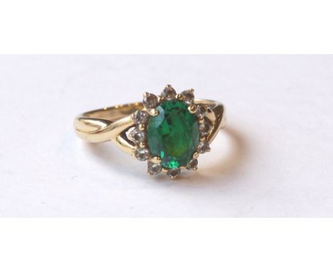 GREEN AND CLEAR GEM SET CLUSTER RING
on nine carat gold shank, ring size R