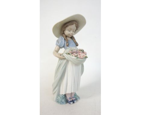 LLADRO FIGURINE 'BOUNTIFUL BLOSSOMS'
number 6756, modelled as a young girl holding a basket of flowers, with original box, 24