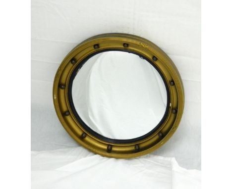 CIRCULAR CONVEX WALL MIRROR
the gilt frame with applied ball finial decoration, 46cm wide 