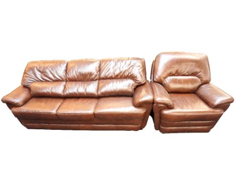 MODERN LEATHER THREE SEAT SOFA
in tobacco brown, together with a matching reclining armchair
 