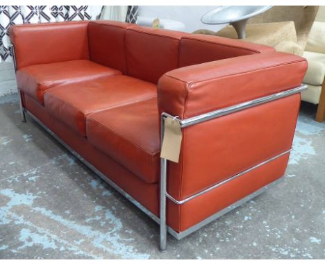 BAUHAUS SOFA, vintage 1970's chrome framed and piped orange leather cushions, 176cm W.