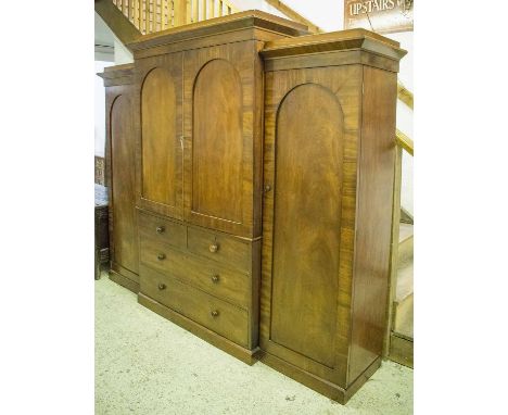 W &amp; C WILKINSON BREAKFRONT WARDROBE, Victorian mahogany with two central arched panelled doors enclosing sliding trays ab