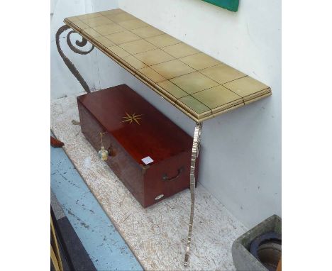 CONSOLE TABLE, with gilded laminate top, on ornate silvered metal supports, 142cm x 42cm x 84cm H.