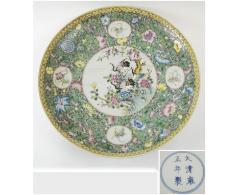 CHINESE CERAMIC CHARGER, 20th century decorated cranes in a landscape on a famille rose palette, bears Yongzheng six characte