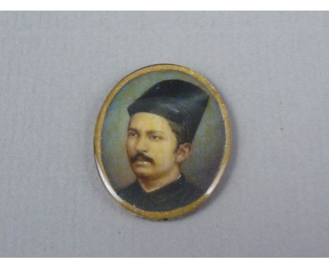 An early 20th Century portrait miniature of an Indian gentleman, watercolour over ivory, preserved under glass, 3 x 2.5 cm 