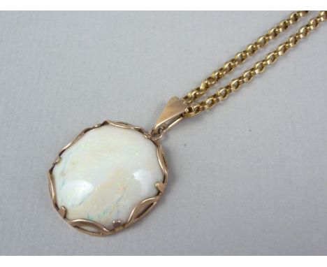 An early 20th Century opal pendant necklace, the cabochon of approximately 24mm, held in a reticulated cusped and pelleted fr