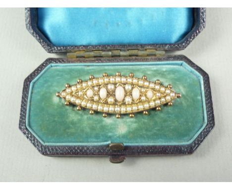 A late Victorian Etruscan Revival pink opal and seed pearl brooch, of lenticular form, having five graded oval cabochons set 