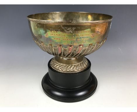 An Edwardian silver rose bowl, bearing gadrooned decoration and an engraved inscription 'Presented to Mr and Mrs Andrew Kirkp