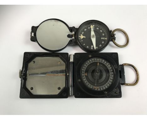 A Second World War German army marching compass, together with a British military Mark 1 Magnetic Marching Compass