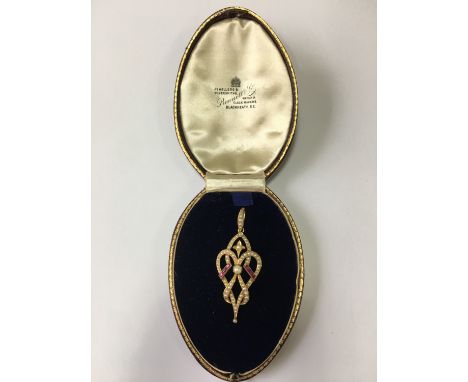 A Belle Époque open-work pearl, ruby and yellow metal pendant, stamped 15 ct, 5.4 cm, 5.2 g