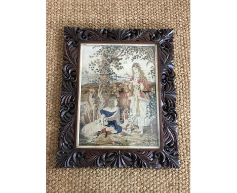 A Victorian petit point tapestry embroidery of a sentimental scene, depicting children and dogs in a floral garden, under gil