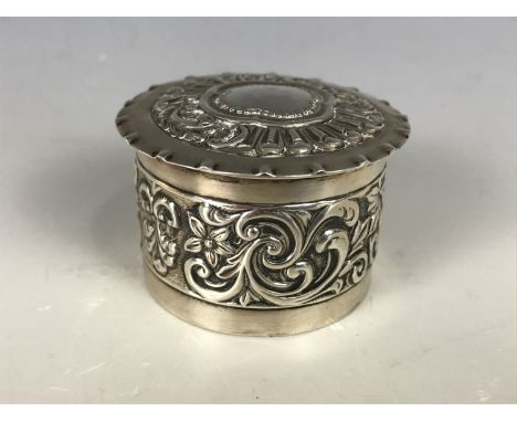 A Victorian silver trinket box, of cylindrical form with slip lid and flange rim, bearing repousse-work decoration, Samuel Ja