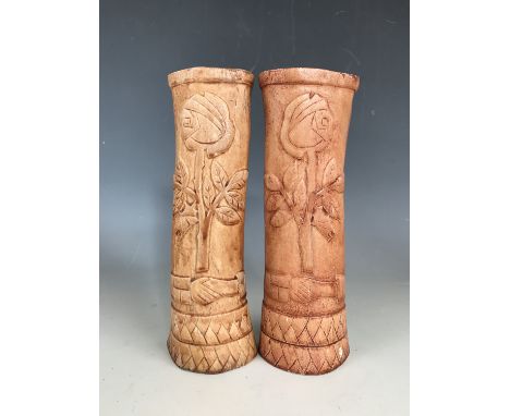 A pair of First World War German prisoner of war work carved bone candlesticks or spill vases