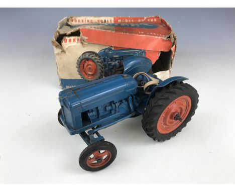 A Chad Valley Co Ltd Working Scale Model of the New Fordson Major tractor, in petrol blue with red wheels, in original lithog