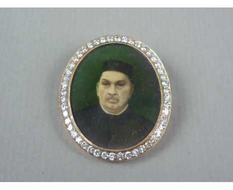 An early 20th Century diamond locket brooch, containing the hand tinted photographic portrait of an Indian Parsi gentleman, t