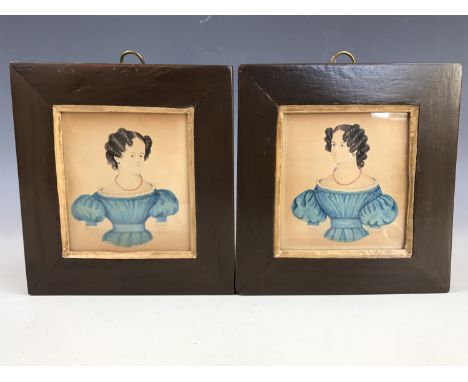 A handed pair of Georgian portrait miniatures, each having a three-quarter length depiction of a single female sitter, each w