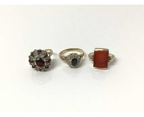 Two 9ct gold gem set dress rings, both size J½ and 10k gold intaglio ring with engraved Roman head, size JCondition report: T