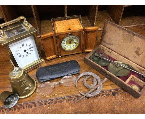Brass cased carriage clock, one other timepiece in wooden case, set scales, pair antique spectacles, trench art lighter and a