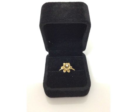 14ct gold daffodil ring set with single stone diamond to the centre on rope twist shank. Ring size JCondition report: Undersi