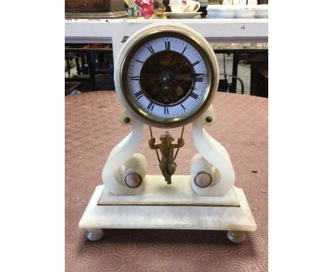 French alabaster mantel clock with gilt cherub on a swing pendulumCondition report: Some nibbles to the edges and two stress 