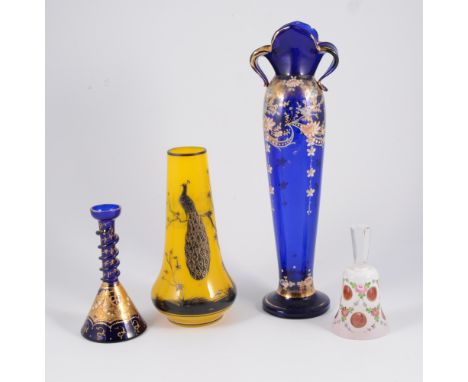 Pair of amethyst tinted cut-glass candlesticks, 98cm; and a small collection of coloured glassware.
