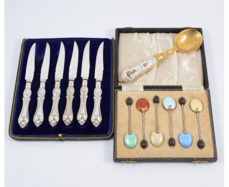 A cased set of silver coffee bean spoons, harequin enamel backs, hallmarked Birmingham 1955, a gilt preserve spoon with ceram