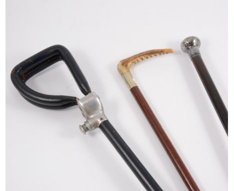 Silver topped cane, 92cm; horn handled riding crop; and a shooting stick. (3)